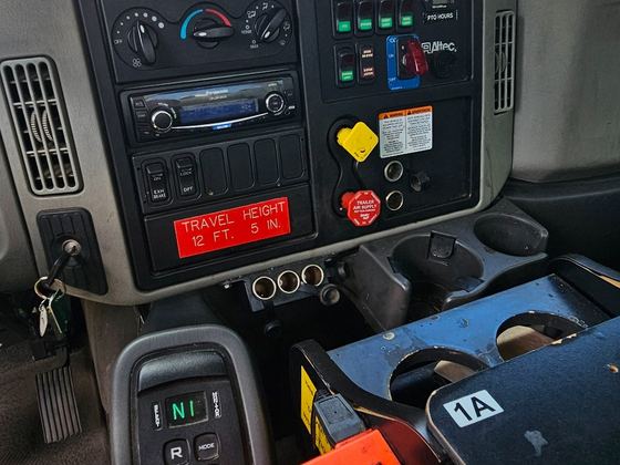 Cab controls, transmission, and PTO panel